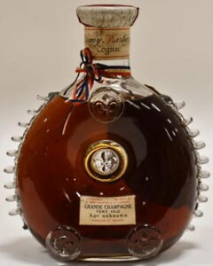 Very old Age unknown, 10 fins; Baccarat is engraved plus logo and number; 26 1/2 fl.oz.; old centaur on top; 1938 Royal Banquet card; bottle no. 57; 1951-1957