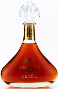 Extra, capsule around neck is longer; 700ml is stated on the back