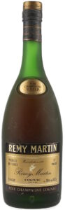 Almost same as previous bottle, but 24 fl.oz 68.2cl in smaller and bolder typeface (1970s)