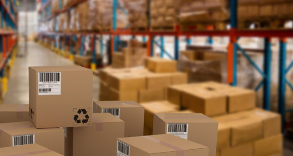 Group,Of,Composite,Cardboard,Boxes,Against,Boxes,On,Pallet,By