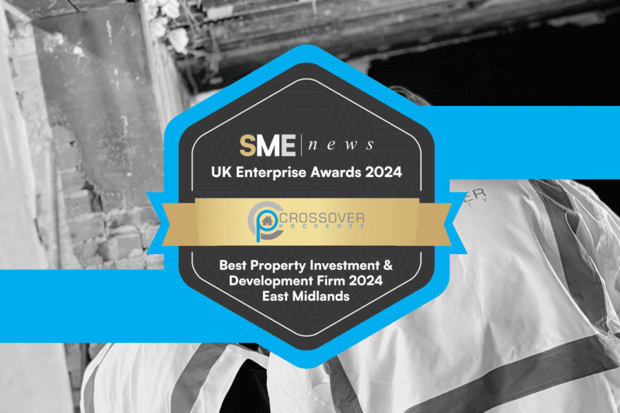 Crossover Property award badge over a black and white image of construction workers. The badge text says: Best Property Investment & Development Firm 2024: East Midlands. This badge was awarded by SME Awards to Crossover Property