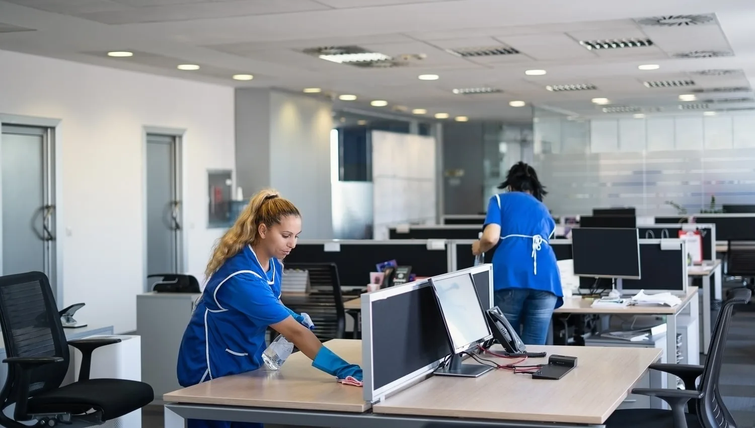 Office cleaners in Derby maintaining desks and shared areas