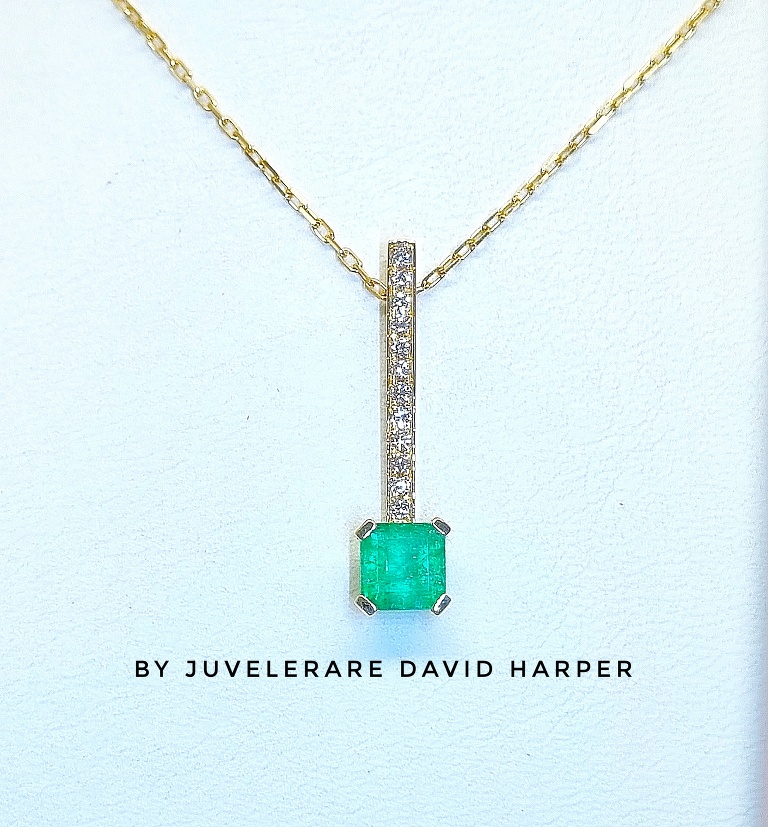 Emerald and diamond pendant.