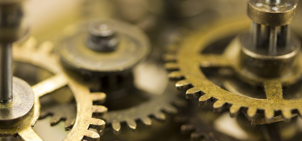 Close up of cogs from the inside of a clock