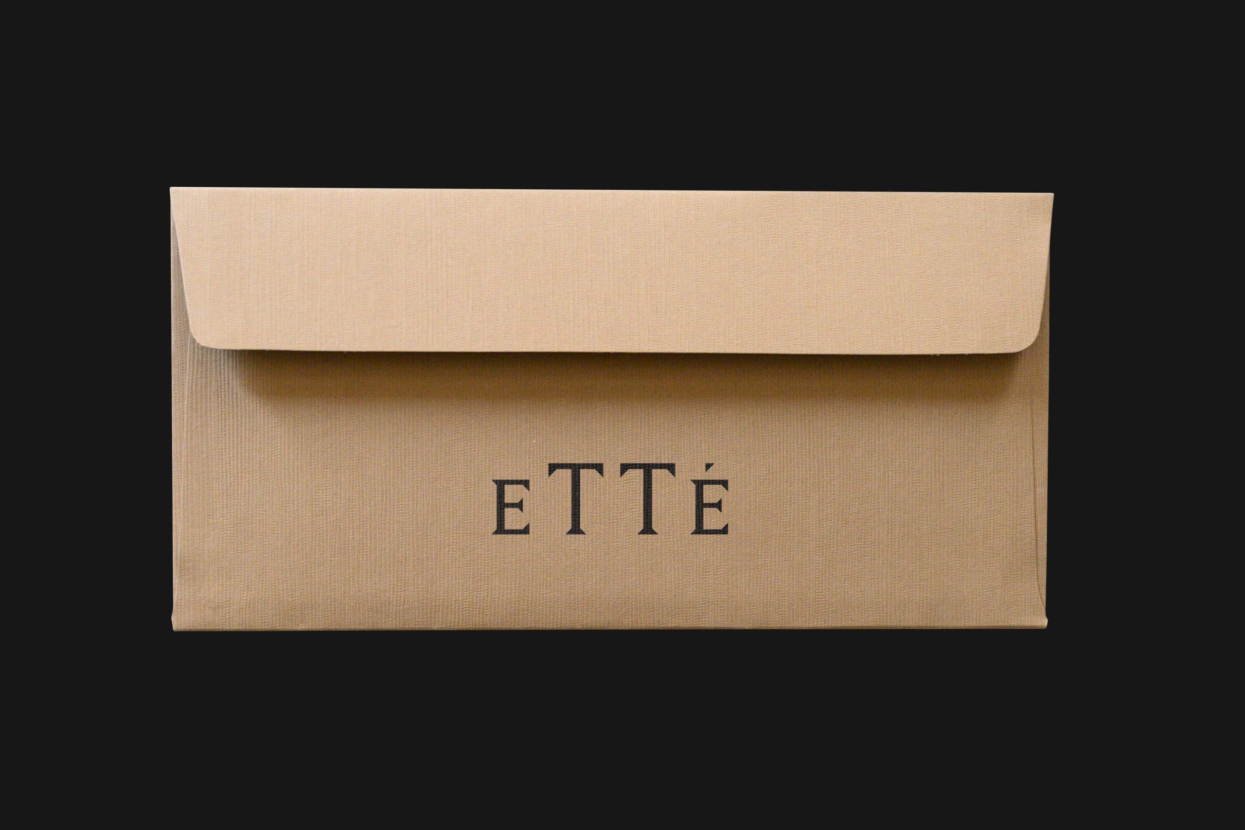 Kraft envelope design for the branding of Etté, photographed on a black background