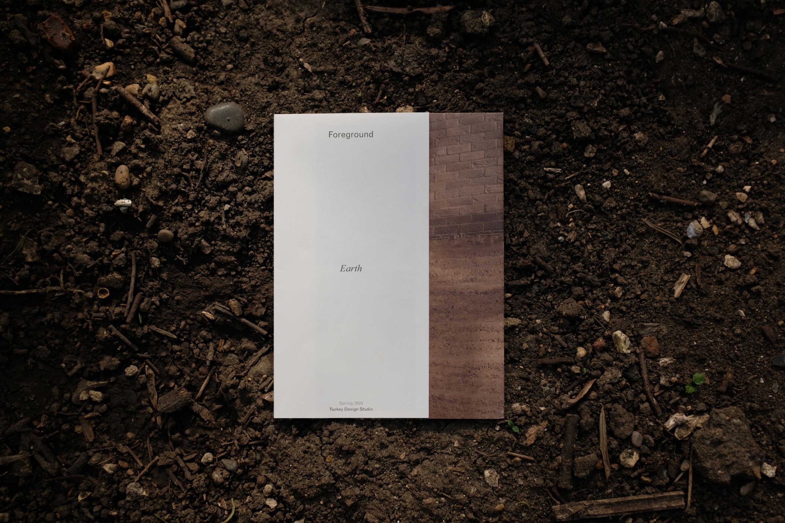 Tuckey Design Studio's 'Earth' publication photographed on the ground.