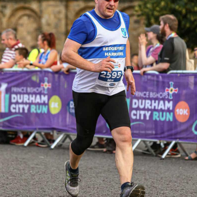 Full body picture of runner at Durham City Run 10k.