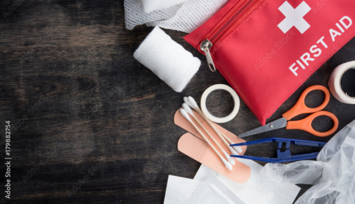 First aid medical kit on wood background,copy space,top view