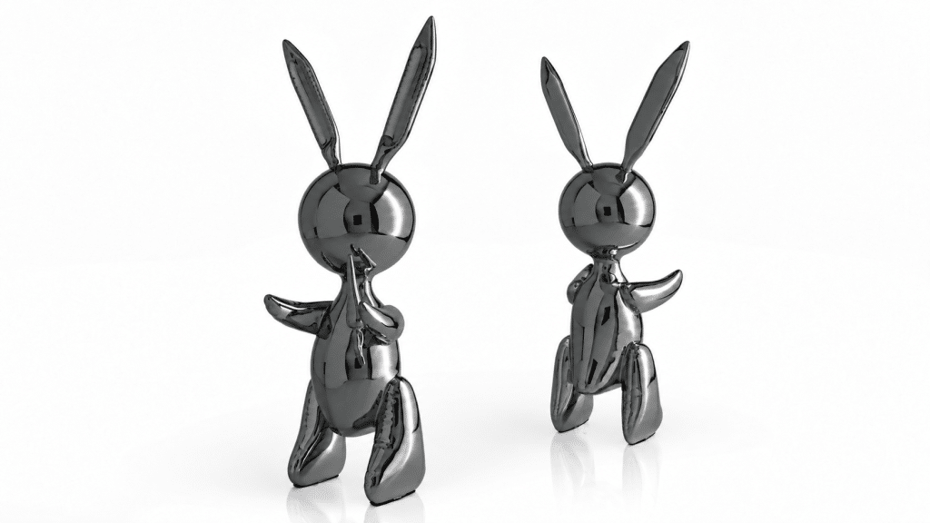 Two Balloon Rabbit XL sculptures in Graphite Black, side by side