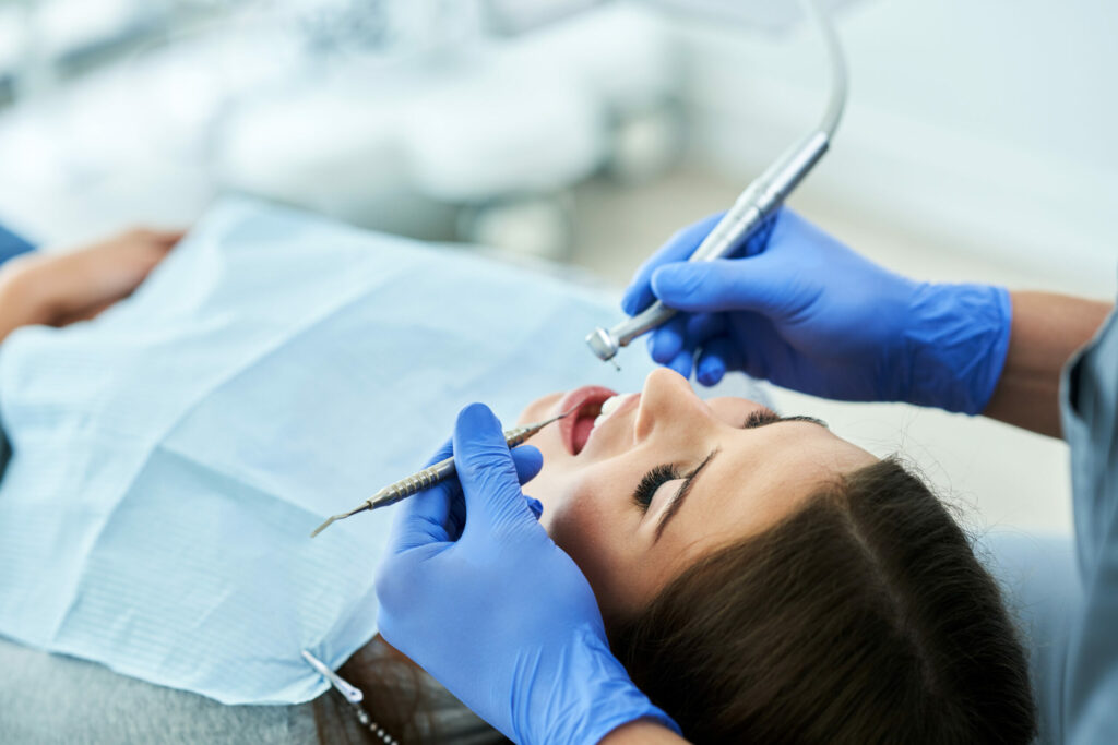 male dentist and woman in dentist office 2022 05 13 01 26 19 utc scaled 1