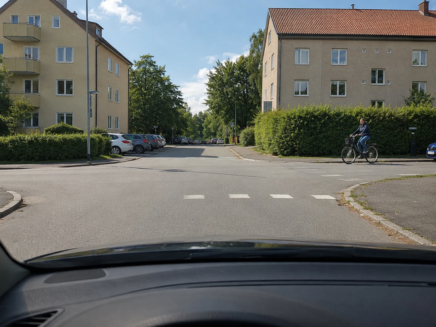 You arrive at a four-way junction where the right-hand rule applies. A cyclist is coming from your right and is riding on the carriageway. Must you give way to 