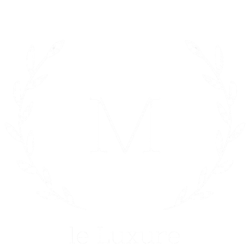 le Luxure luxury brand logo featuring elegant laurel wreath and monogram M