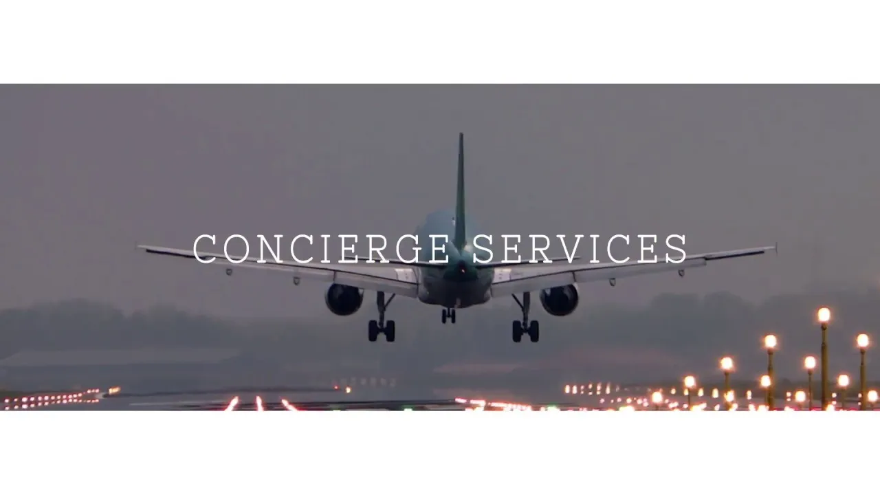 Commercial airplane landing on illuminated runway at dusk with "LE LUXURE LUXURY CONCIERGE SERVICES" text overlay