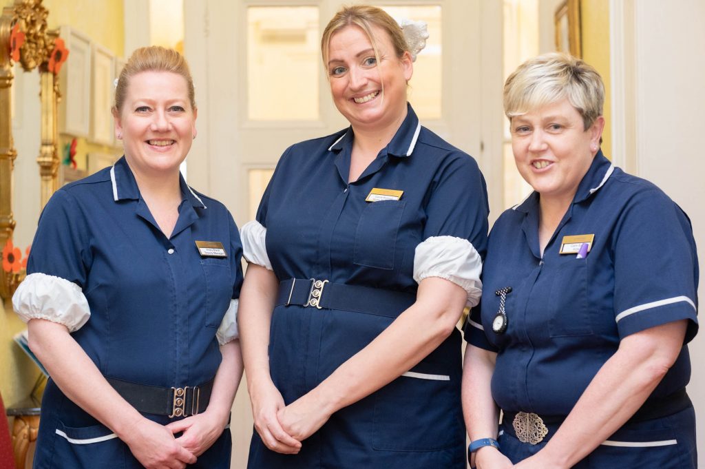 3 members of staff smiling