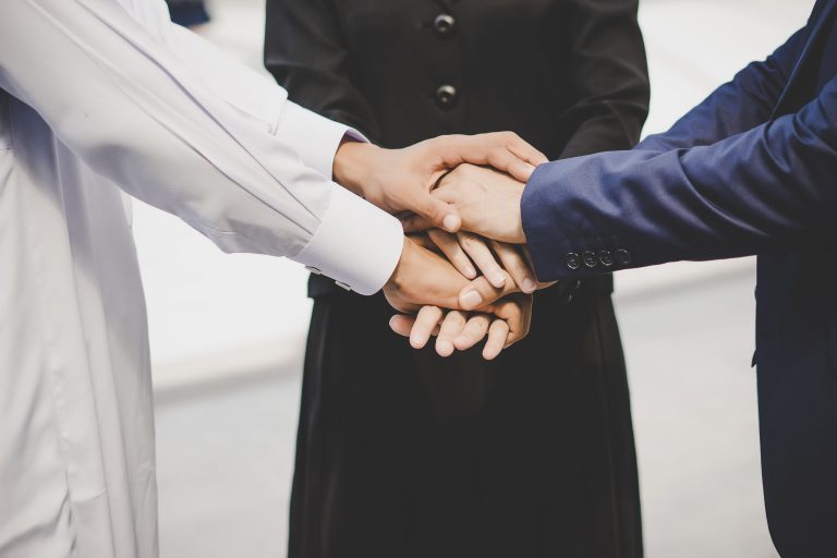 عن مكتب الشاطئ 1 business team stack hands support start up new project