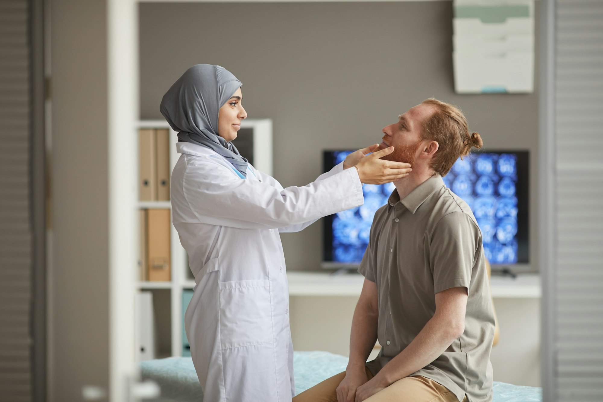 Doctor holding medical exam