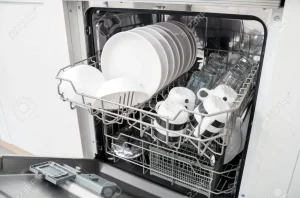 87862708 open dishwasher with clean dishes in the white kitchen