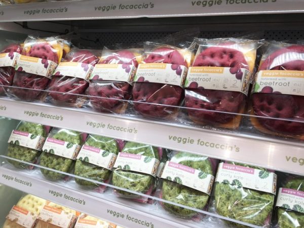 Shelf stacked with Veggie coloured Focaccia's by Boboli