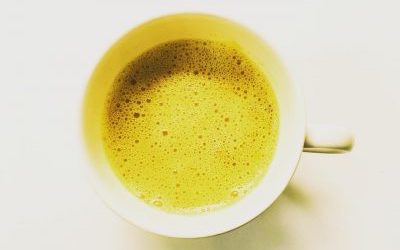 Turmeric latte in white cup and saucer