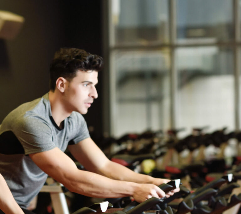 Couple in a spinning class wearing sportswear