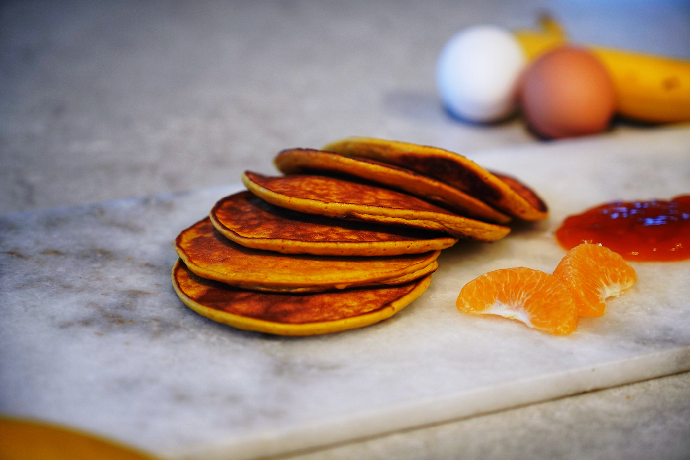 Banana and saffron pancakes with mango and passion jam