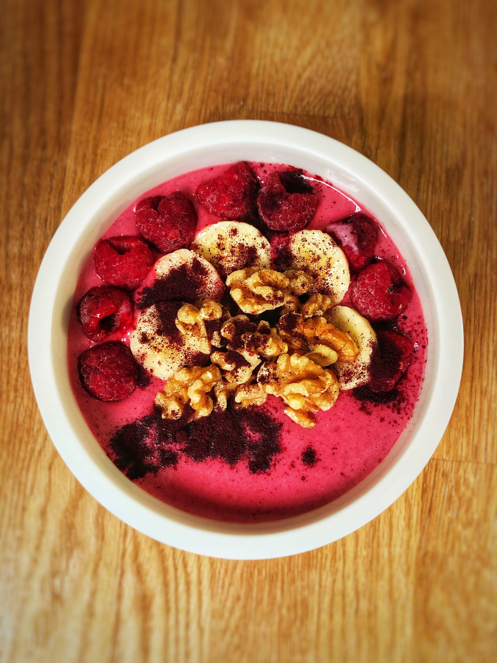High protein raspberry and banana smoothie bowl