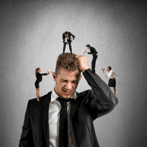 Stressed man with images of busy people on his head