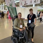 A man and a woman, the CTO and CEO of Eyemind at a disability aids fair