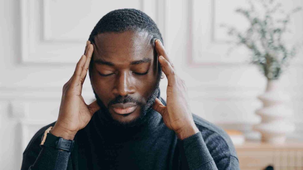 An African American man who is exhausted