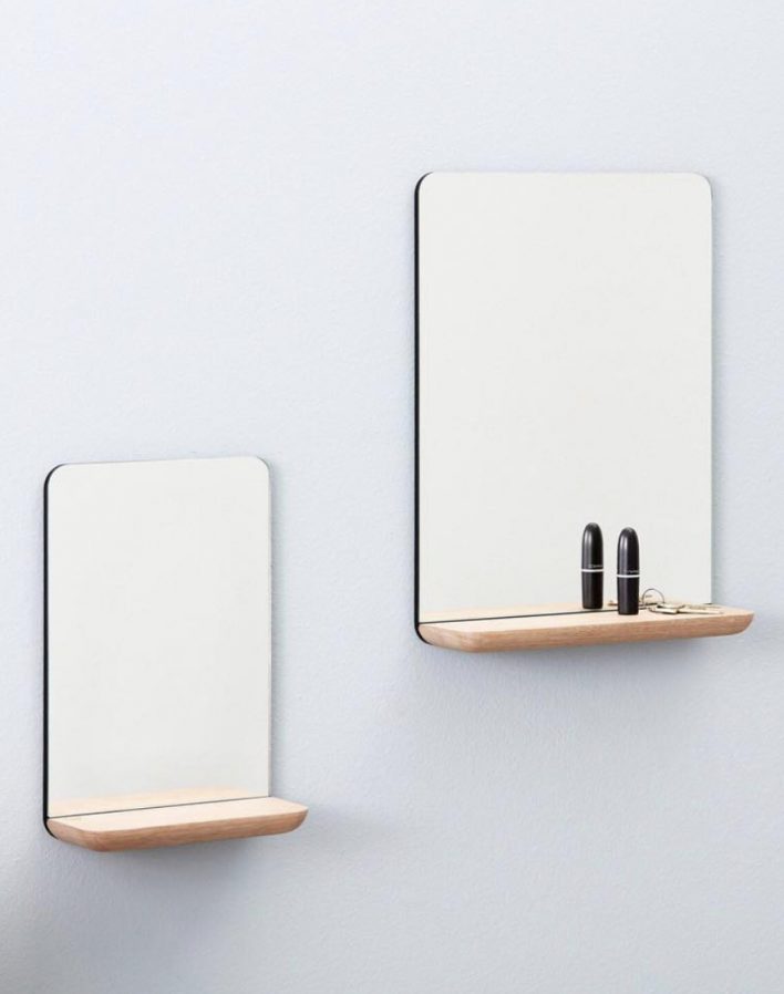 A wall mirror by Andersen Furniture Design Louise Siig