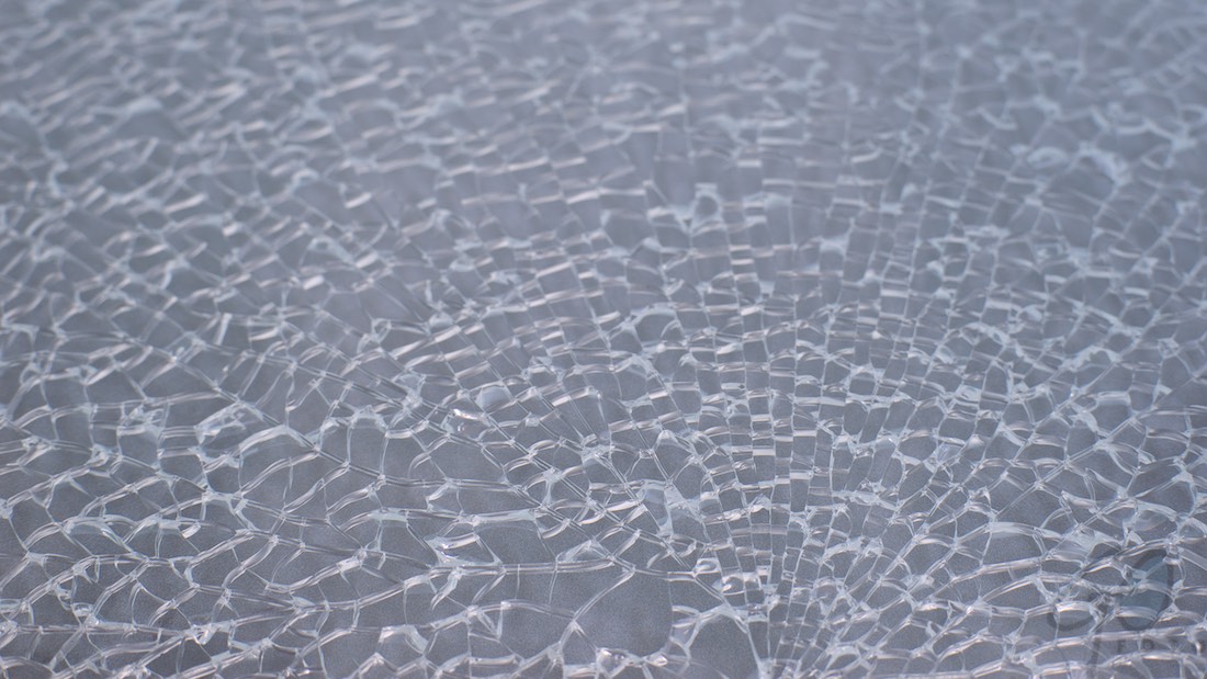Carglass C70 OK. Foto van een glasplaat met barsten.