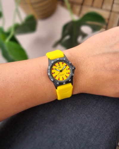 yellow childrens watch from gul watches on ladys arm