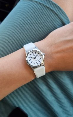 white childrens watch from gul watches on ladys arm