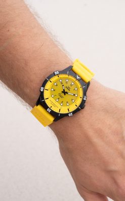 yellow Waterproof watch from gul watches on mans arm powered by sun light