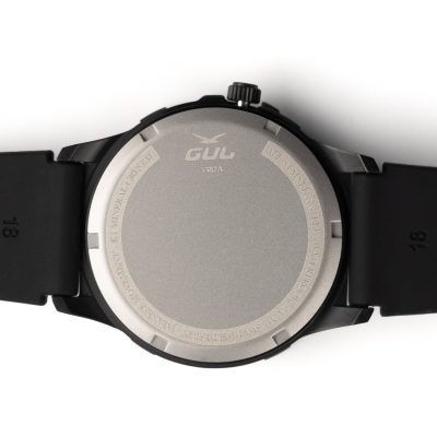 Back view of a black wristwatch showing the metallic case back with brand logo and text engravings.