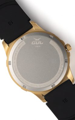 Back view of a gold wristwatch showing the metallic case back with brand logo and text engravings.