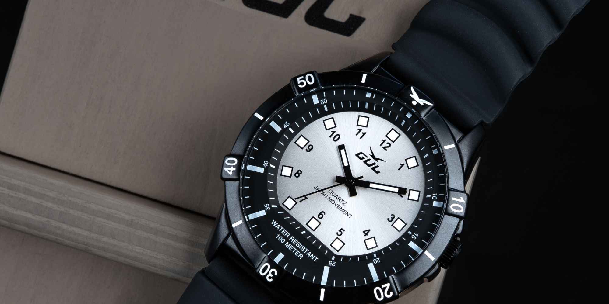 black and silver gul watch