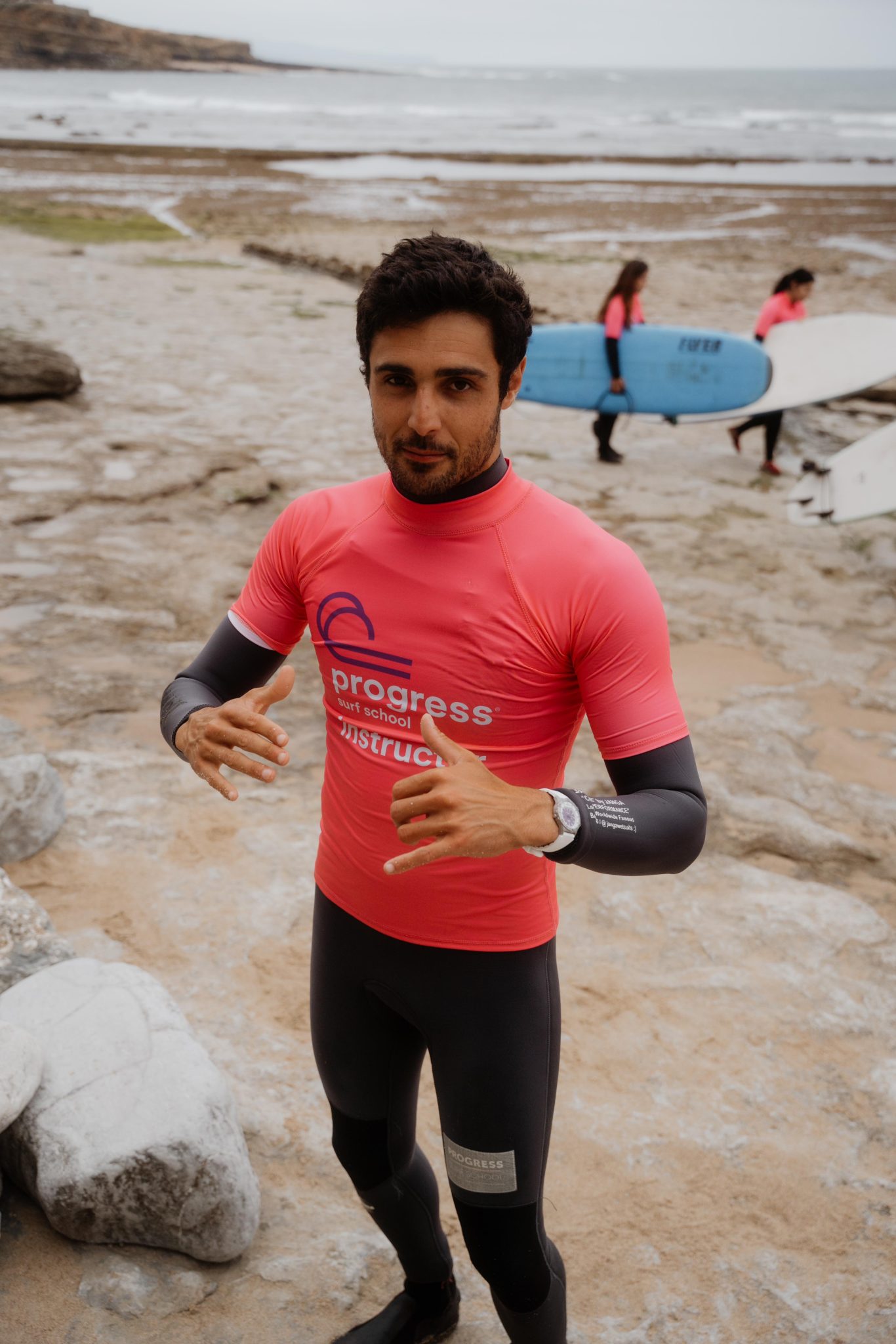 gul watches Progress surf school instructor posing