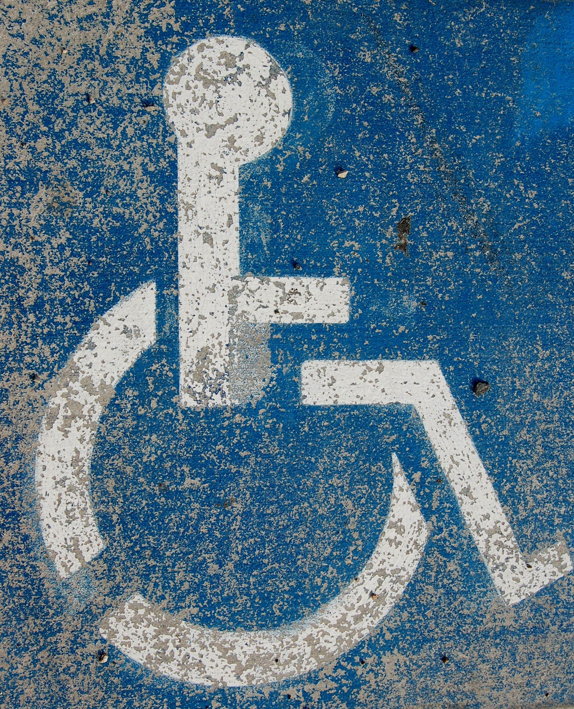 Muddied disabled parking sign 