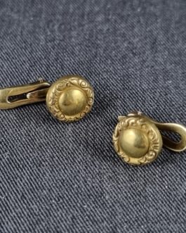 A pair of breast buttons