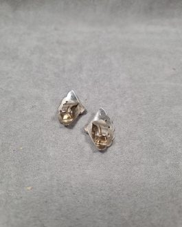 A pair of silver ear clips