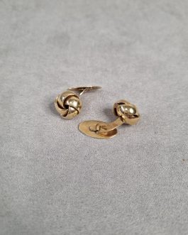 A pair of cufflinks in the form of knots
