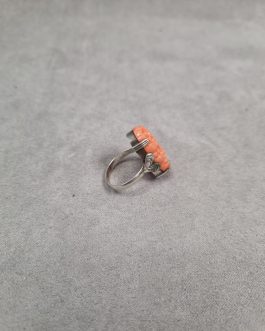 Silver ring with carved coral