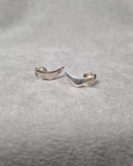 A pair of silver stud earrings