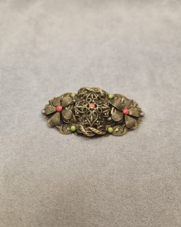 Bijouteribroche med farvede sten
