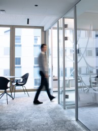 Person waling into an office