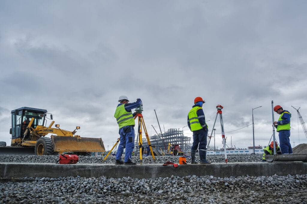 Surveyor builders worker with theodolite