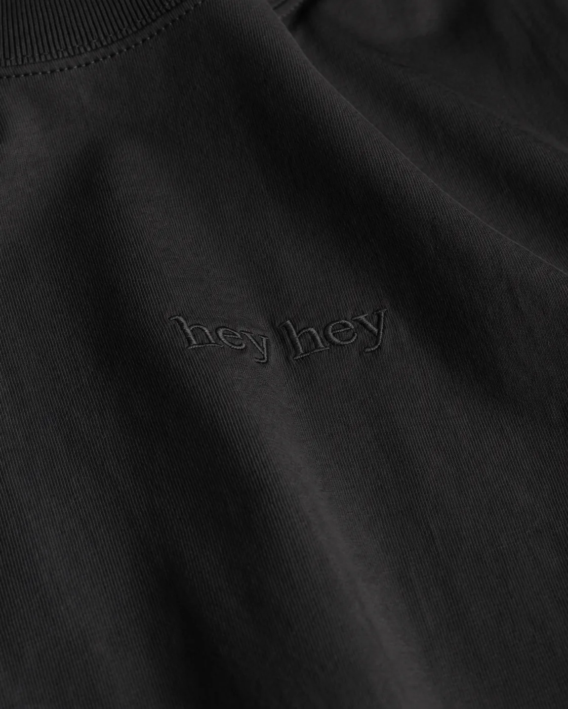 tone-on-tone hey hey embroidery on the chest of the essential shirt