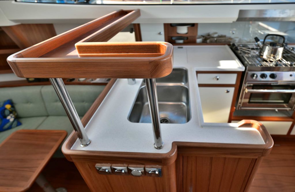 Shelf in galley. Supports do double duty as handholds.