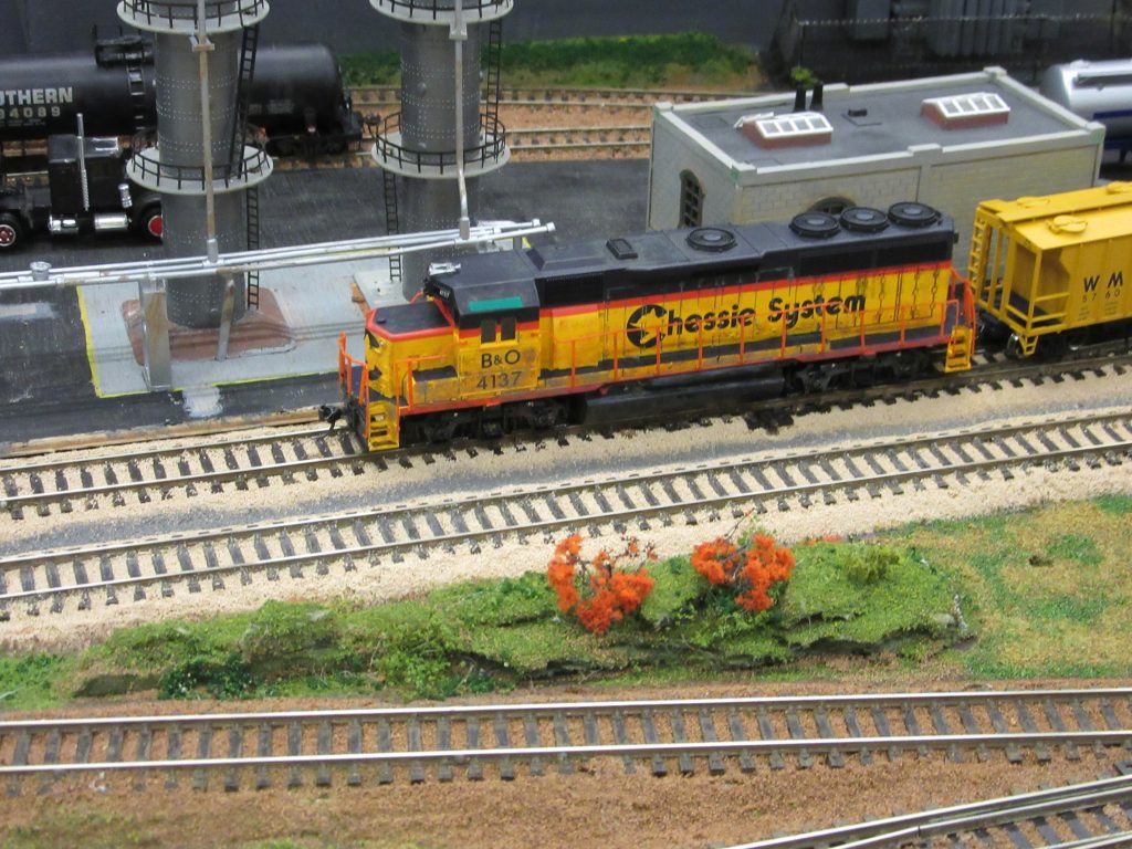 Baltimore & Ohio SD45 locomotive passes the chemical works hauling an intermodal train